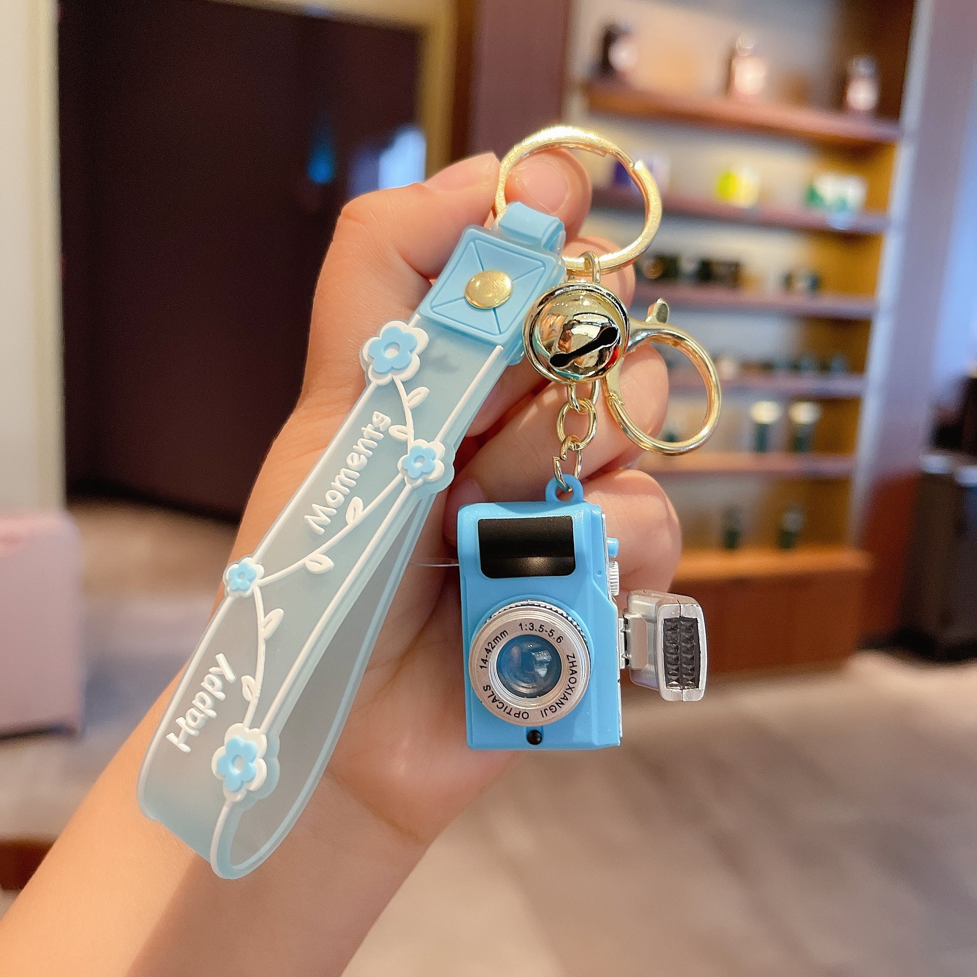 Wholesale Acrylic LED Lighting and Sounding Daisy Simulation Small Camera Keychain